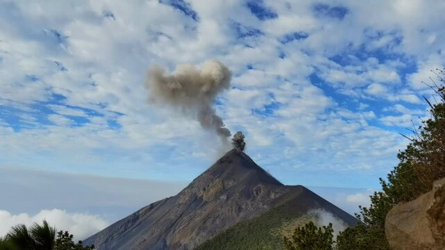 Volcanic ash plume rising from Volcan de Fuego crater, filmed from a basecamp lookout on Acatenango, Guatemala.