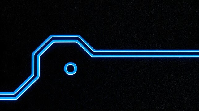 Macro shot of a neon blue circuit board trace