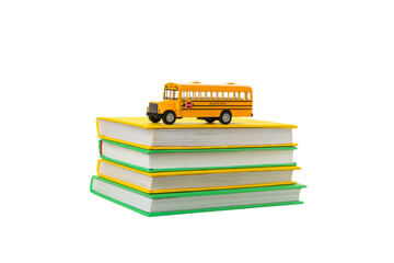 Toy bus on colorful school books, isolated on white, PNG © Atlas