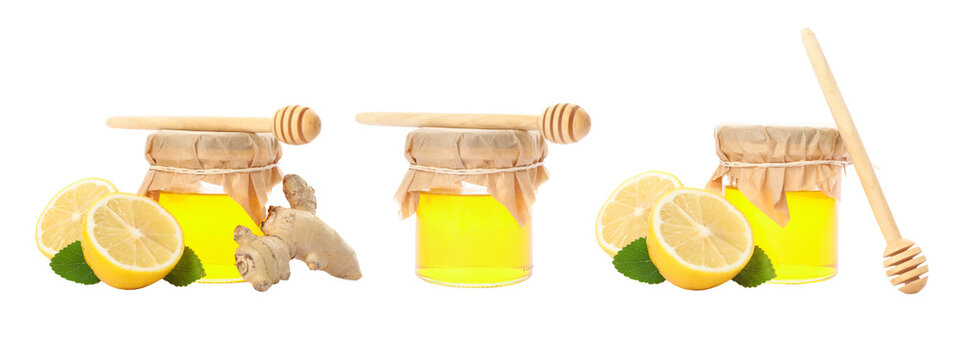 Set. Jars filled with honey sit alongside lemon slices and ginger root, PNG
