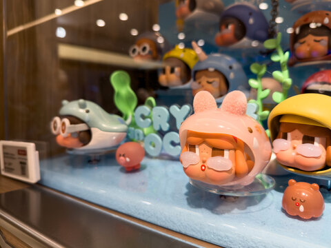 PENANG, MALAYSIA - JUL 21, 2026: Crybaby collectible character figures displayed inside retail store showcase.