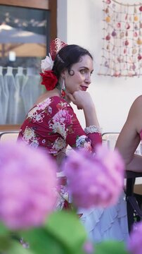 Elegant Spanish Flamenco Woman Portrait in Colorful Traditional Costume at a Charming Old Town Cafe