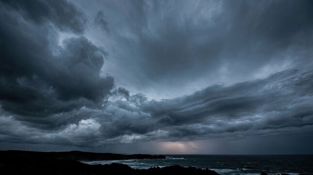 Dark storm clouds gather over a rugged coastline. A powerful thunderstorm rages, with flashes of lightning illuminating the turbulent sea.