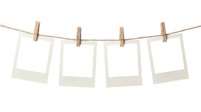 Vintage instant photo frames hanging on clothesline with wooden pegs, blank polaroid style film set for memory gallery isolated on Transparent Background