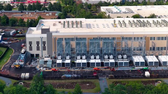 Aerial view of a large data center under construction at the site