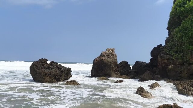 Rugged rocks stand firm against crashing ocean waves