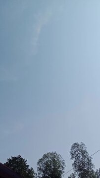 Clear Blue Sky with Soft White Clouds