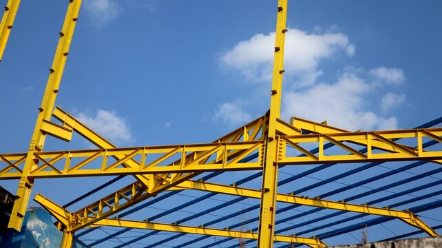The yellow steel construction frame of the building