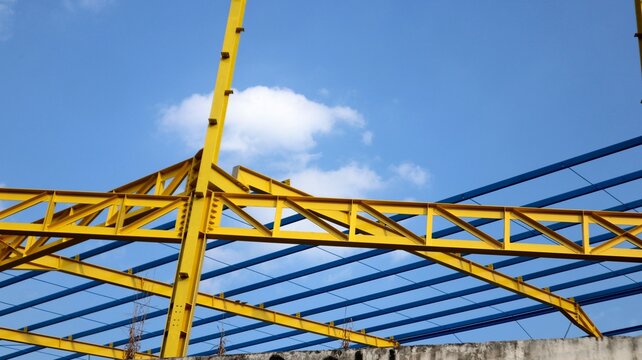 The yellow steel construction frame of the building