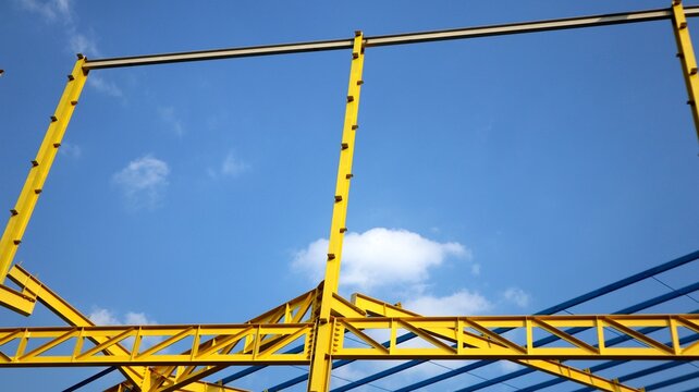 The yellow steel construction frame of the building