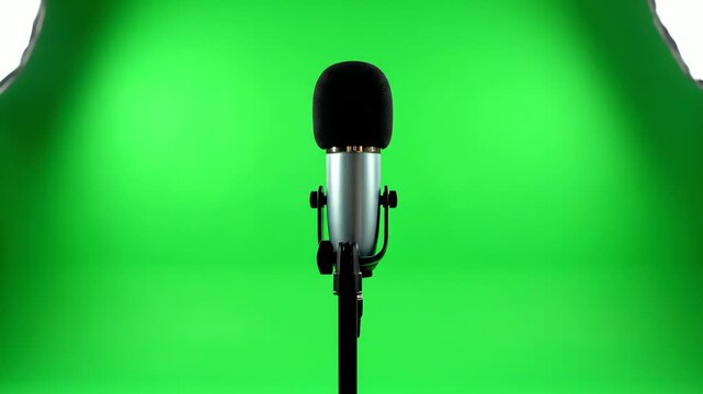 Microphone on stand with green screen background