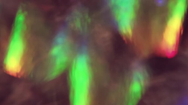 Defocused twinkle flash. Glare art. Pink green blue colorful illuminated glint lens leaking on dazzle optical creative background.