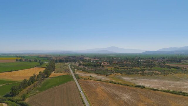 Balat, Turkey. Miletus archaeological site, wide aerial drone view over the ancient Hippodamian grid plan and major ruins under a clear summer sky. Aerial View