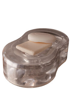 Clear plastic soap dish holding two different bars of soap, offering concepts of hygiene, skincare, wellness, and self care on a transparent background for various uses