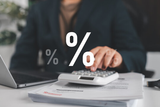 Business finance and percentage analysis concept with professional using tablet and laptop, representing financial data, investment growth, tax calculation, sales performance and digital analytics.