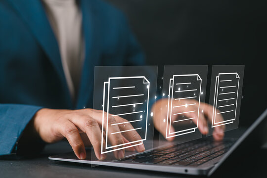 Business professional typing on laptop with digital document management interface, online file storage, data organization system, cloud technology, and paperless office workflow concept.