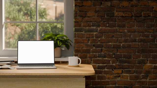 3D Illustration of Modern Home Office Desk with Laptop Blank Screen, Coffee Mug, and Brick Wall Background
