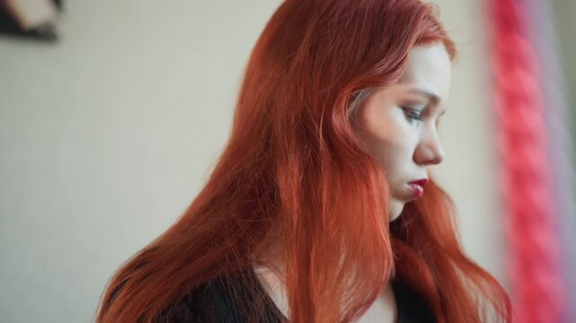 Closeup redhead caucasian woman pensive, soft indoor light, glitter eyebrow makeup, layered silver necklace, long auburn hair, quiet melancholy, subtle head turns, intimate cinematic mood