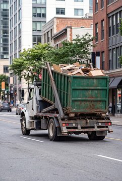 Roll Off Dumpster Collection Truck in Urban Area