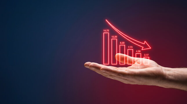 Hand holding glowing red downward bar chart hologram showing financial loss with copy space, Economic downturn and stock market crash concept showing falling graph on dark background.