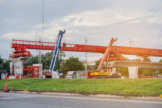 A structures at a construction site for a new concrete road and bridge, with steel beams and cranes at work a crucial infrastructure project for a major city.