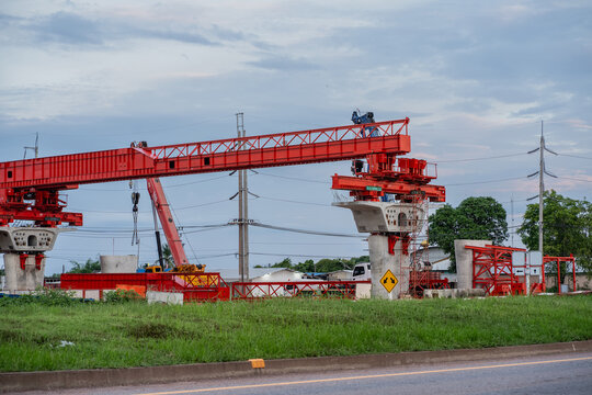 A structures at a construction site for a new concrete road and bridge, with steel beams and cranes at work a crucial infrastructure project for a major city.