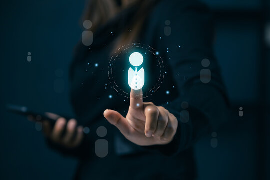Businesswoman selects a virtual user profile while holding smartphone, representing recruitment, human resources, customer targeting, digital identity, and online network management.