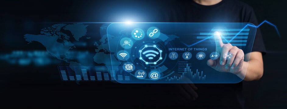Network technician using modern interface for Internet of Things. Specialist managing smart device connectivity, processing sensor data feeds, and optimizing interconnected node performance.