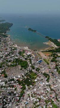 Vertical View Of Saman&aacute; Bay And The Town Of Santa B&aacute;rbara de Saman&aacute; In Saman&aacute; Province, Dominican Republic. Aerial Pullback Shot