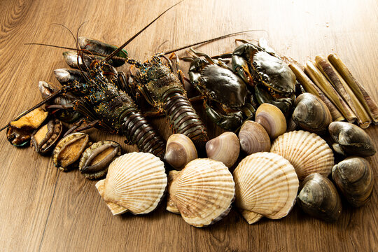 Seafood fresh from the ocean displayed on a wooden table at a market
