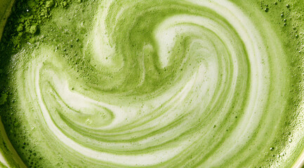 Fototapeta premium frothy matcha latte with its signature vibrant green color and delicate swirling foam patterns, a macro and full-frame texture shot, close-up texture, and top view