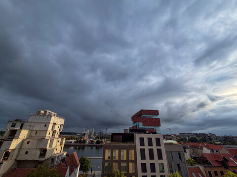 Antwerpen, Belgium, July 22, 2026 - Dramatic storm clouds gather over the modern skyline and MAS museum district in Antwerpen, Belgi&euml;