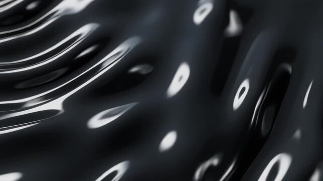 Glossy black magnetic fluid undulates in smooth continuous waves across flat surface, creating subtle silver reflections under soft overhead lighting with sleek futuristic motion.
