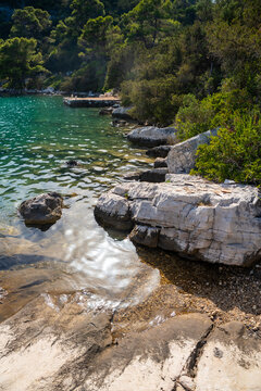 View of Veliko Jezero or Big Lake in Mljet National Park on Mljet Island in Croatia. Protected Mediterranean nature and peaceful lake landscape concept.