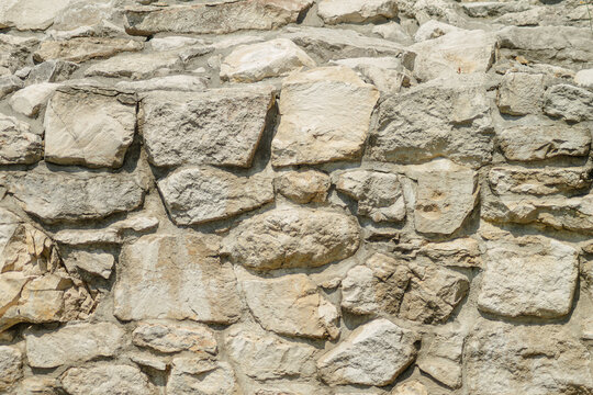 Weathered stone castle wall with rough masonry texture  closeup detailed material for PBR real photography