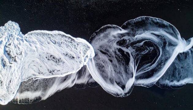 Smoke swirls in dark background abstract.