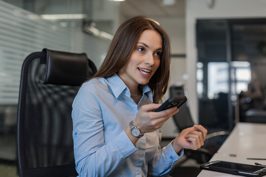 Cheerful businesswoman female smiling receiving message reading good news sms using mobile app.