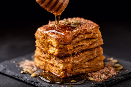 square-cut pumpkin spice biscuit stack drenched in dark honey