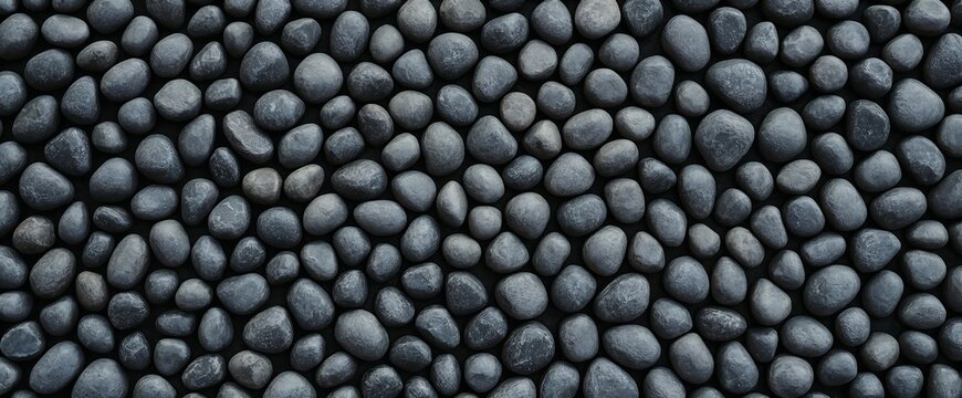 Natural black pebbles stones background texture with background material landscape wallpaper abstract close-up