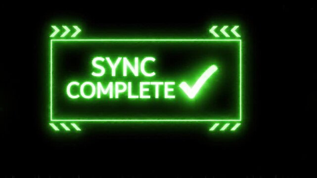 Green sync complete text display with digital data glitch effect