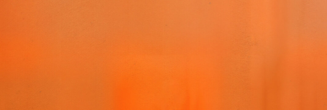 Warm orange texture with gentle tonal variations across a plain surface.