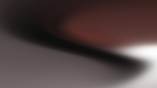 Abstract gradient of warm terracotta and deep charcoal tones with soft luminous light and blurred motion creating a modern artistic background