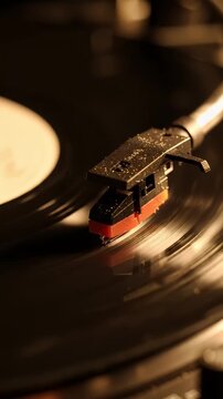 Record Player Needle on Spinning Vinyl Record - A close-up shot shows a record player needle gently touching a spinning vinyl record, capturing the classic sound experience.