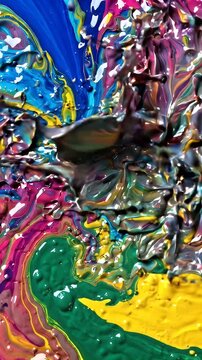 Vibrant Multi Colored Paint Swirling and Mixing Abstract Background - A dynamic and abstract visual showcasing vibrant, multi-colored paints in constant motion.