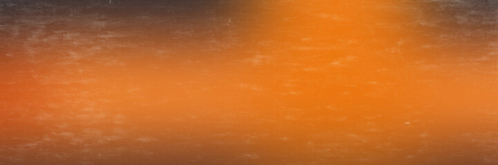Fototapeta premium Abstract horizontal gradient texture featuring dark edges blending into a vibrant warm orange center with gradient background displays charcoal edges transitioning