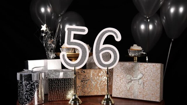 Silver Number 56 with Silver Glitter Sparkles with Gifts and Balloons and Cupcakes for Party Fifty Six