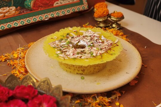 Ghewar a rajasthani sweet garnished with dry fruits and rabdi