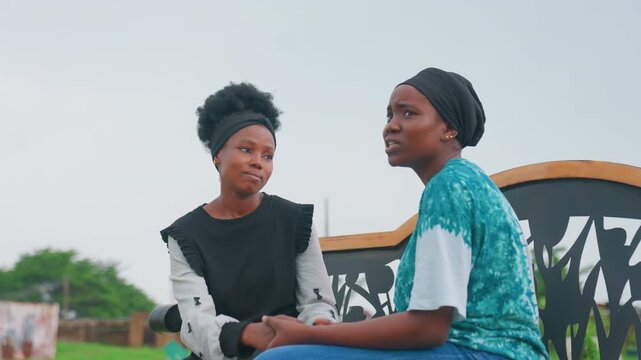 Black mother and child planning future together on bench, animated discussion about goals and career, mother offers encouragement and practical advice, bright sky and open park, optimistic mood