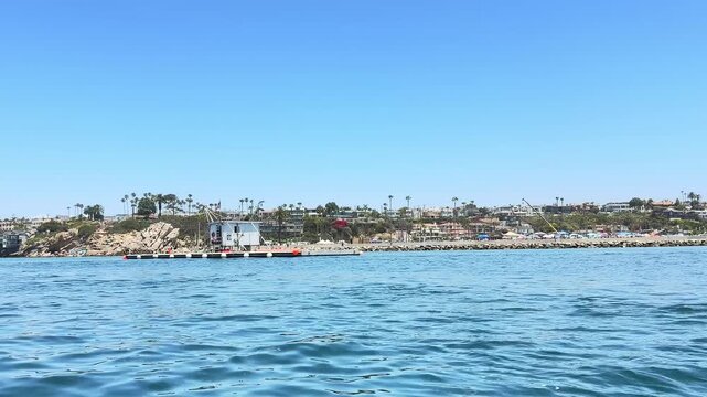 Experience everyday life at Newport Harbor with boats, sea lions, waterfront homes, and incredible views along the Southern California coastline.