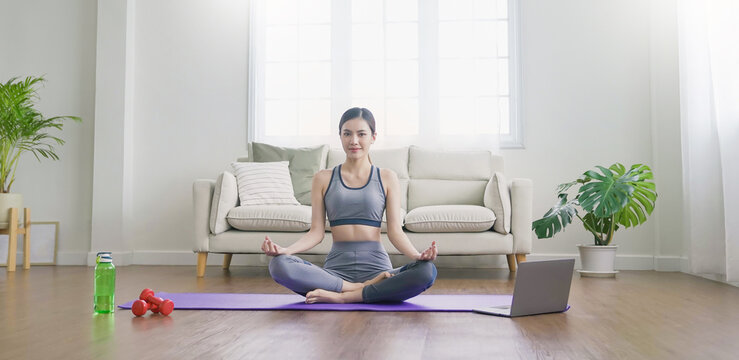 Portrait of young beautiful asian korean woman warm up exercise workout yoga position at home living room. Sporty girl health care lifestyle. Yoga for beginner, asian wellbeing, healthy  longevity